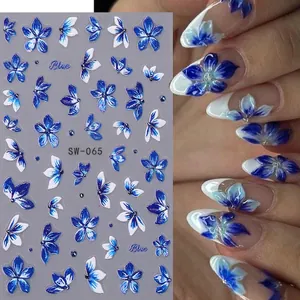 Embossed blue floral nail art stickers with lily and bellflower designs for manicures