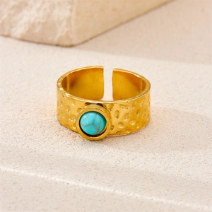 Macro view of 18k gold plated hammered ring with round turquoise stone inlay