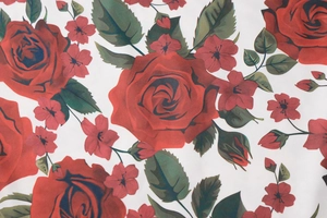 Detailed view of red rose floral print on high-quality white fabric for summer maxi dress