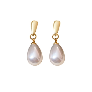 French vintage gold drop earrings with elegant white teardrop pearls on white background