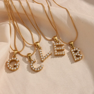 18K gold plated snake chain necklace with pearl-inlaid letter pendants on silk