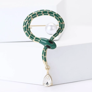 Green enamel snake brooch with round white pearl and a teardrop crystal drop charm