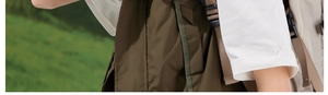 Detailed outdoor view of olive tactical vest and beige backpack with adjustable straps