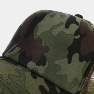 Close-up of jungle camouflage mesh trucker hat with detailed stitching and breathable fabric
