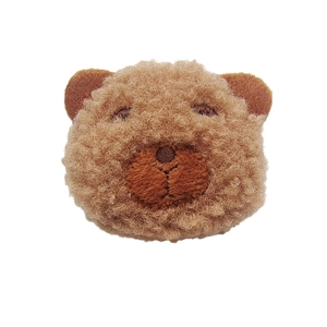 Plush brown bear head accessory with soft faux fur and detailed embroidery on white background