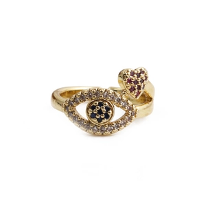 Gold open ring with zircon evil eye motif and a red heart pendant on a white background