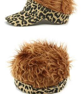 Detail view of leopard print baseball cap featuring brown faux hair and adjustable strap