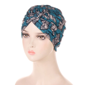 Macro shot of turquoise and monochrome leaf print on elastic headscarf turban