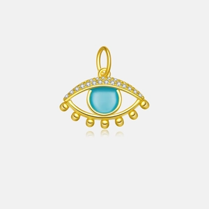 Macro view of gold S925 sterling silver evil eye pendant with blue gemstone and tiny beads