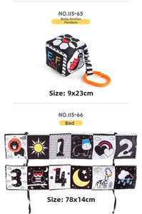 Detail view of black and white newborn cloth book and stroller hanging toy with dimensions