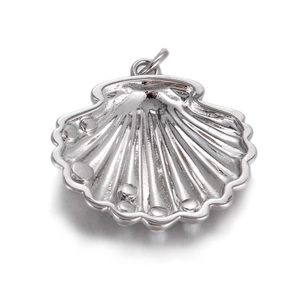 Detailed macro view of silver shell-shaped pendant with textured surface for jewelry DIY