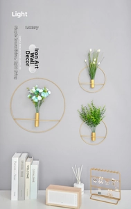 Three-piece gold metal circular wall hanging vases with glass tubes for floral decor