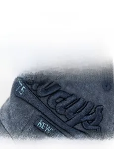 Close-up of vintage washed cotton baseball cap featuring high-density 3D letter embroidery