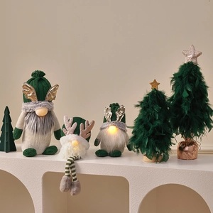 Lighted green Christmas gnome figurines and feather trees for festive tabletop decoration