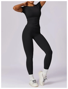 Detail of high-stretch black yoga set showing slim fit t-shirt and high waist leggings