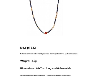 Detail view of lapis lazuli and red agate beaded necklace with stainless steel spacers