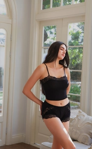 Detail of black lace trim on seamless wireless bra and matching underwear set