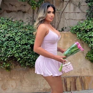 Pink ruched V-neck mini dress with ruffled hem and slim fit for summer fashion wear