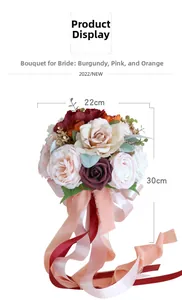 Detail view of burgundy and champagne bridal bouquet with decorative satin ribbons