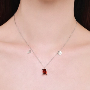 S925 silver necklace featuring a red rectangular zircon pendant worn on a model's neck