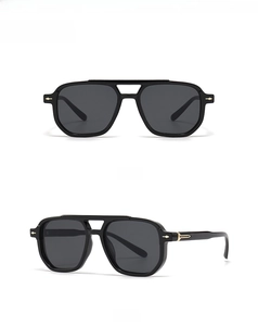 Front and 45-degree side views of black square sunglasses with gold arrow hinge details