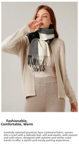 Detail shot of black and grey plaid scarf showing soft faux cashmere texture and fringe