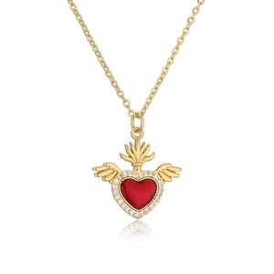 Golden sacred heart necklace with red enamel and zircon wings on white background