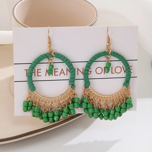 Bohemian geometric round hoop earrings with green handmade bead fringe and gold hooks
