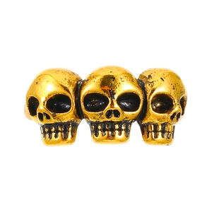 Punk style golden three-skull head open ring with vintage finish on white background
