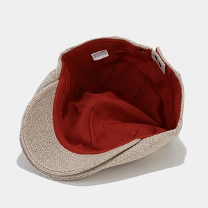 Minimalist beige textured beret hat with a brick red inner lining and premium fabric finish
