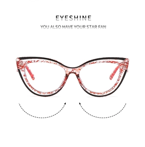 Detail view of cat eye TR90 frame with unique red and black textured pattern design