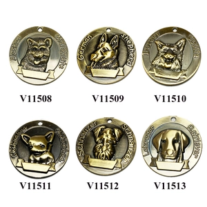 Detail view of antique bronze dog tags featuring embossed breeds for collars