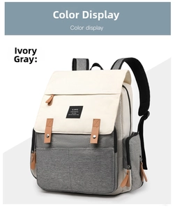 Close-up of dual-tone cream and grey diaper bag with premium leather accents and side pocket