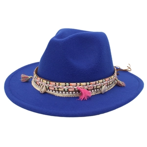 Detail of royal blue fedora with shell pendants and colorful fringe tassels