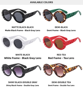 Detail view of round oversized sunglasses in six colors with unique wavy embossed temples