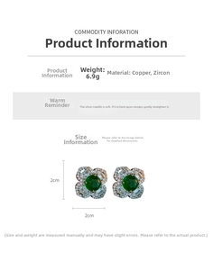 Detailed view of four-leaf clover earrings with green stones and cubic zirconia stones