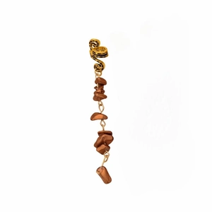 Gold ear cuff detail featuring brown natural stone fringe on a minimalist background