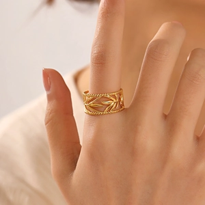 Adjustable 18K gold plated hollow leaf stainless steel ring shown on model hand