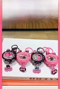 Close-up of cute cartoon cat TV keychains with LED lights and glitter interior