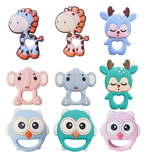Macro detail of various colorful animal-shaped silicone baby teethers and pacifiers