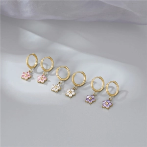 Three pairs of elegant gold flower hoop earrings with pink white and purple zircon crystals