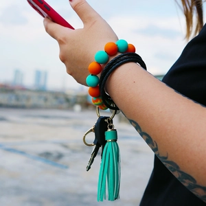 Silicone beaded bracelet keychain with cyan tassel and black leather wrist strap