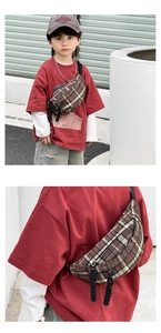 Detail of kids brown checkered chest bag with adjustable strap and textured zipper