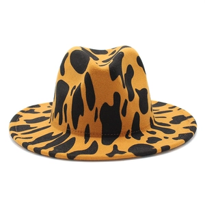 Detail of high-quality yellow and black leopard print wool fedora hat with a flat brim