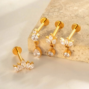 F136 titanium gold labret stud jewelry with sparkling zircons on textured stone