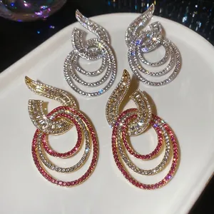 Elegant geometric hollow circle drop earrings with shimmering crystals and silver needles