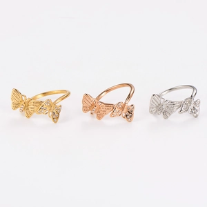 Three-piece set of butterfly rings in gold, rose gold, and silver with inlaid crystals