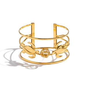 Polished 18K gold-plated stainless steel cuff bracelet with sea turtle and wire ball accents