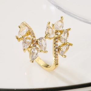 Irregular geometric open ring with pear-cut cubic zirconia and gold finish