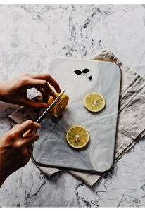 Detailed top view of rectangular marble ceramic tray with gold rim and grey textures